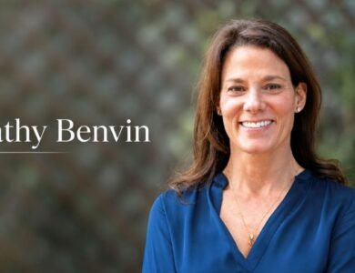 Kathy Benvin portrait with blurred background and name text
